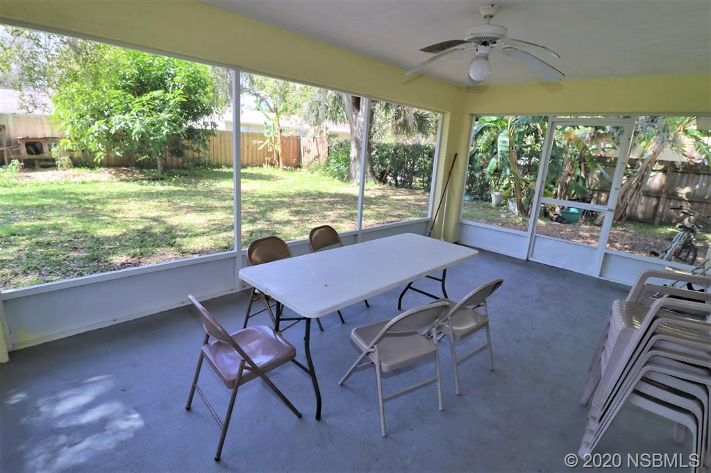 3316 Mango Tree Drive Edgewater, FL 32141 - Photo 22 of 28 a view of a dining room with furniture window and outside view