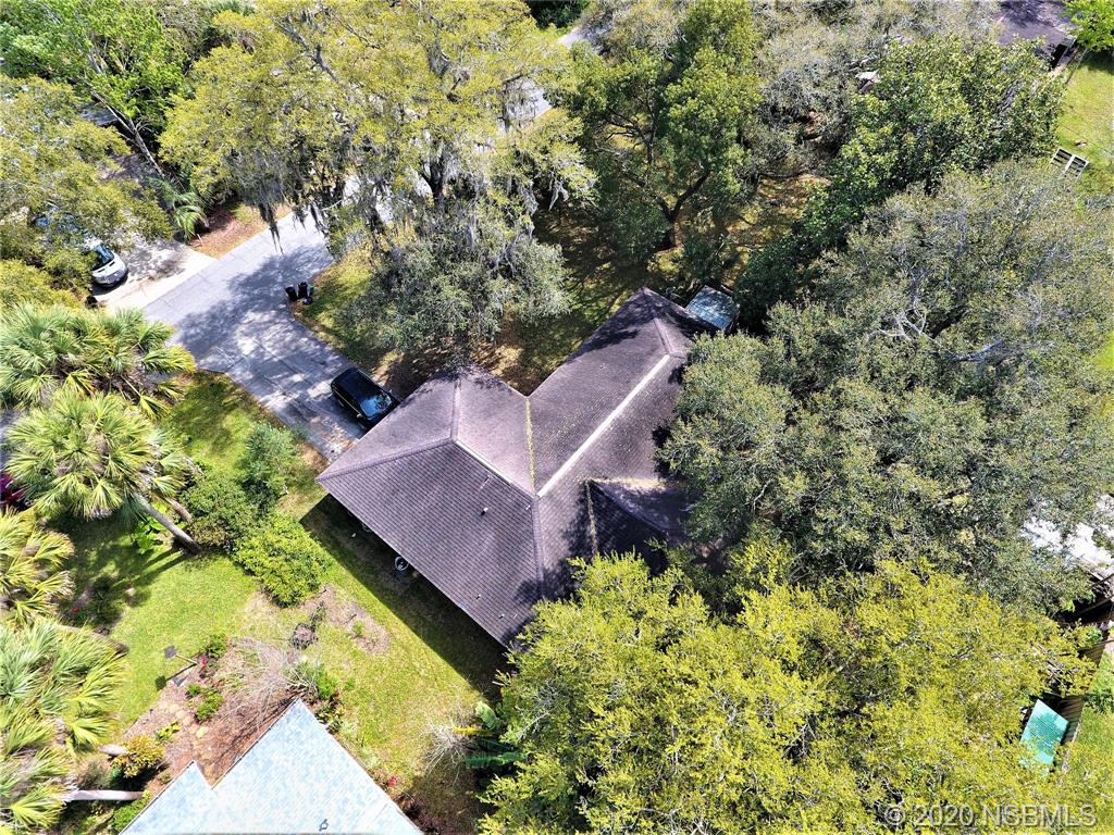 3316 Mango Tree Drive Edgewater, FL 32141 - Photo 27 of 28 an aerial view of a house with a yard and garden