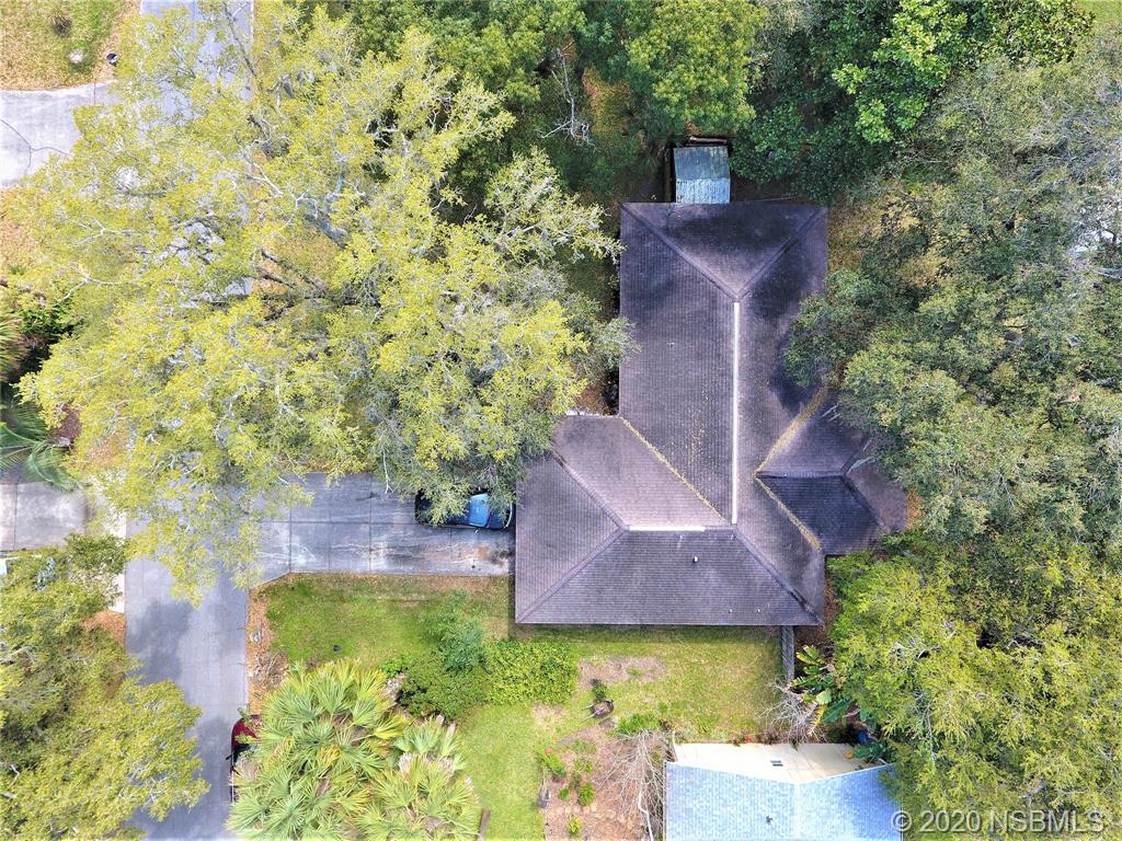 3316 Mango Tree Drive Edgewater, FL 32141 - Photo 28 of 28 an aerial view of a house with a yard