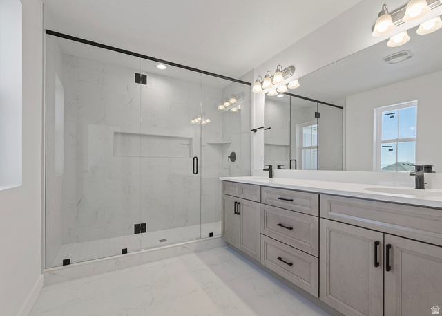 11214 South Easy Bee Road, Unit 270 South Jordan, UT 84009 - Photo 25 of 31 Spacious bathroom featuring a glass-enclosed shower with tiled walls and a built-in niche