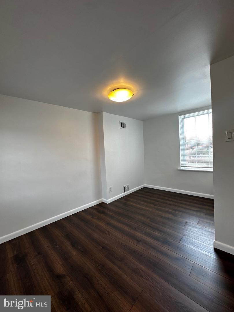 810 South Howard Street Philadelphia, PA 19147 - Photo 11 of 21 a view of an empty room with wooden floor and a window