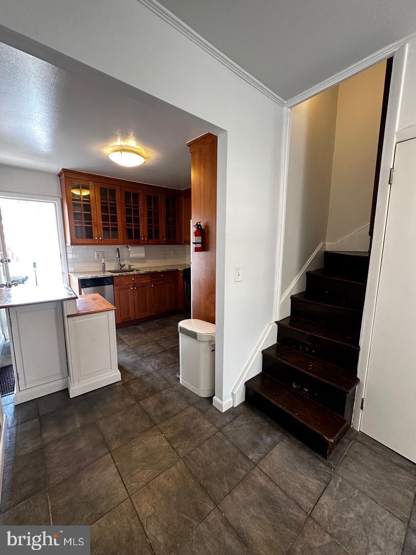 810 South Howard Street Philadelphia, PA 19147 - Photo 6 of 21 a living room with stainless steel appliances furniture a rug and a view of kitchen