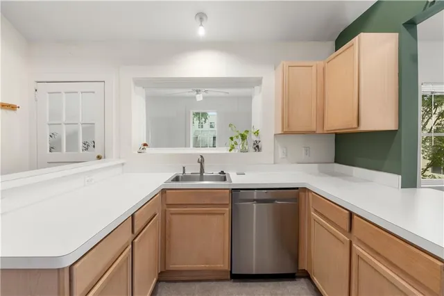 a bathroom with a sink and a window