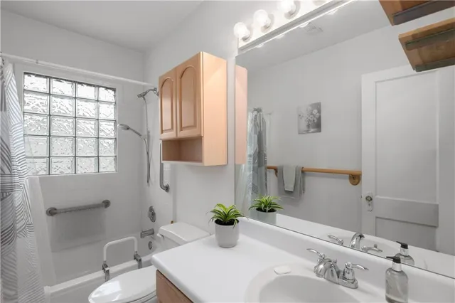 a bathroom with a shower curtain