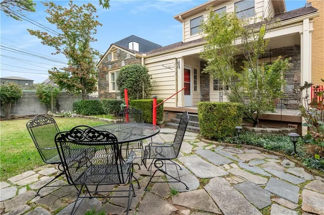 a view of a chairs and table in the patio