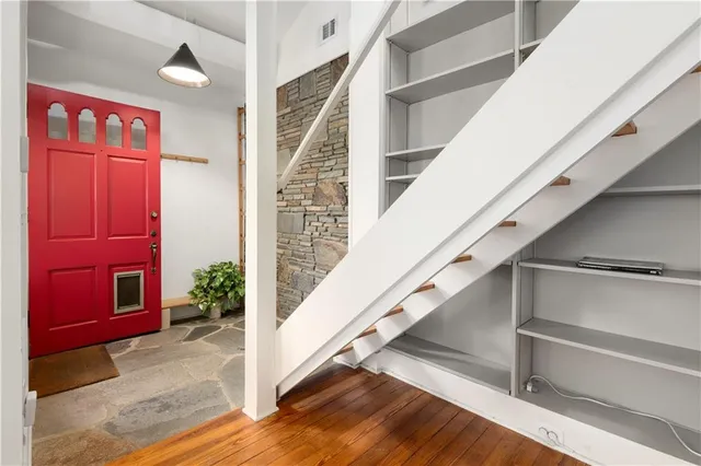a view of entryway with wooden floor