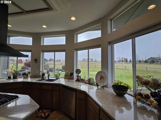 a large bathroom with a sink and a large mirror