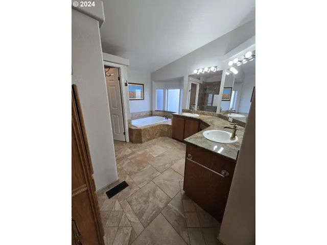 a living room with furniture and a dining table