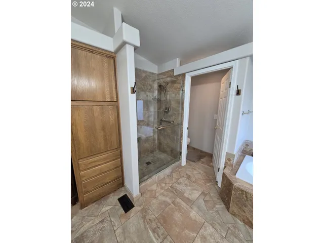 a view of a livingroom with furniture and a workspace