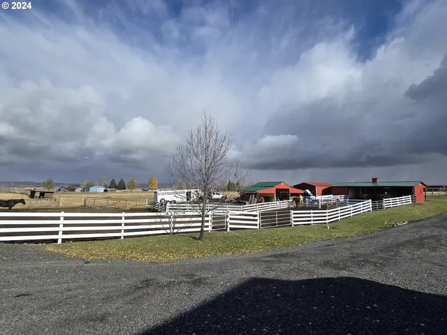 a front view of house with yard and seating area