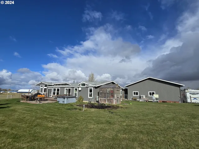 a backyard of a house with lots of green space