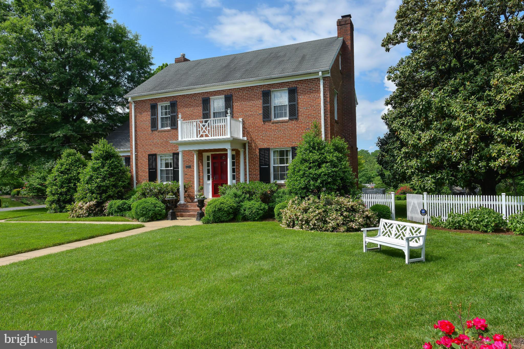 418 West Braddock Road Alexandria, VA 22302 - Photo 1 of 1 a front view of a house with a garden
