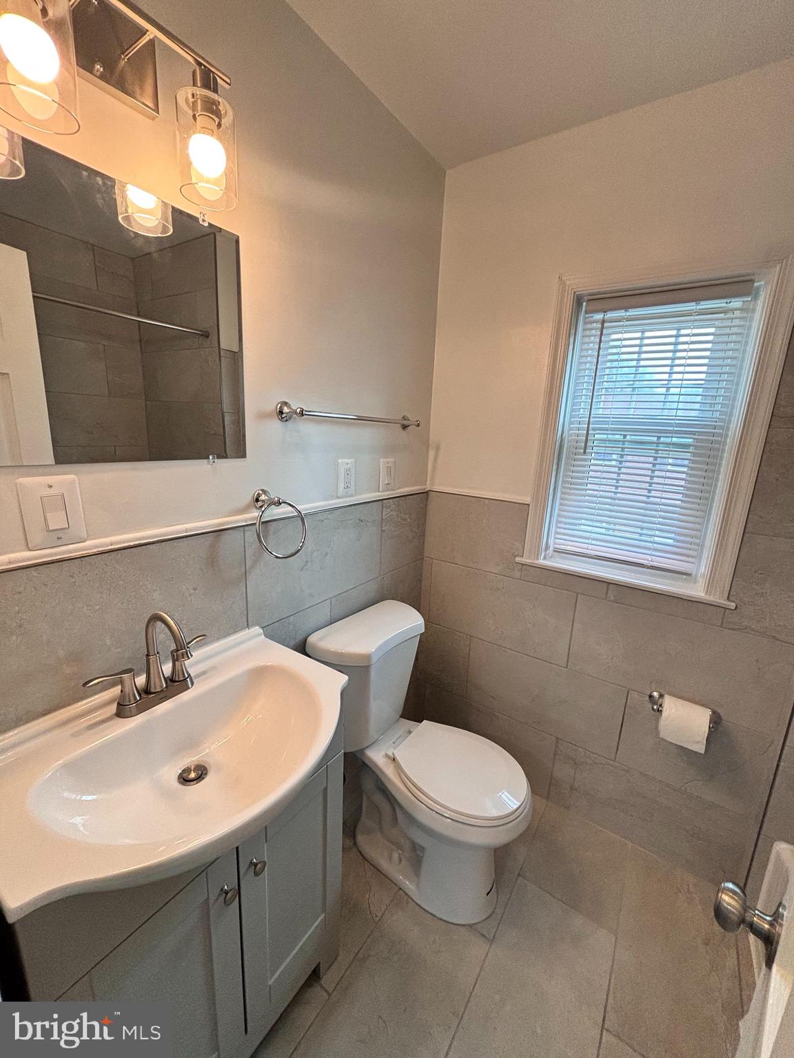 3810 V Street Southeast, Unit 301 Washington, DC 20020 - Photo 11 of 30 Bathroom view w/ new sink & vanity