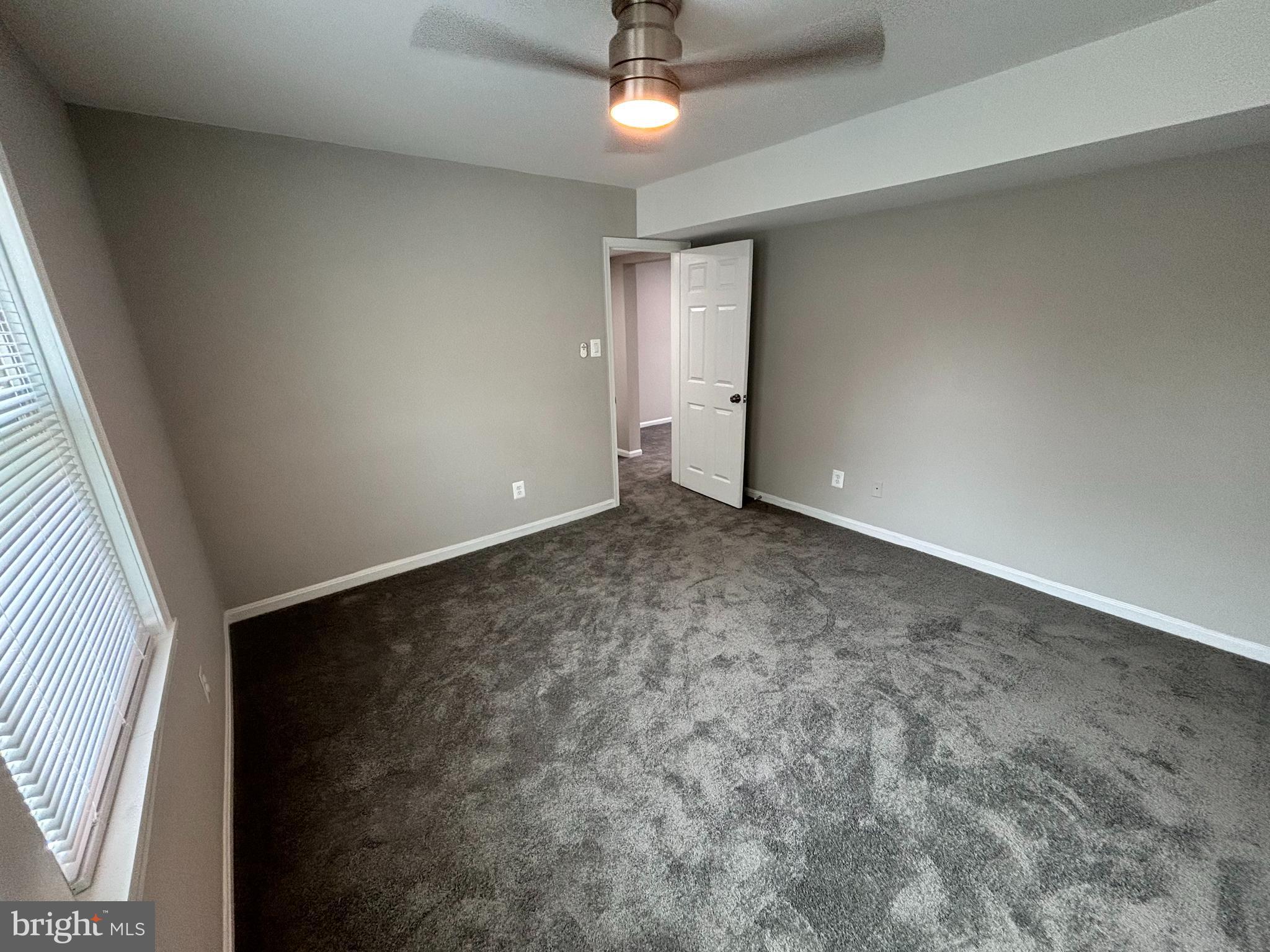 3810 V Street Southeast, Unit 301 Washington, DC 20020 - Photo 15 of 30 Spacious Bedroom w/ new carpet & freshly painted