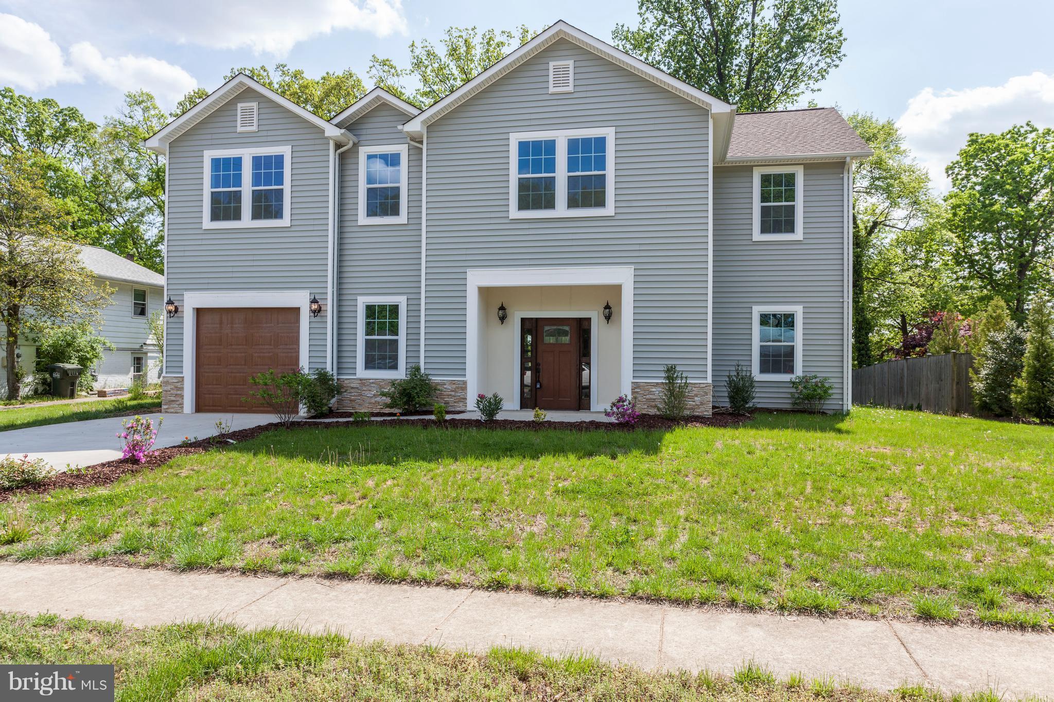 7505 June Street Springfield, VA 22150 - Photo 1 of 29 a front view of a house with a yard