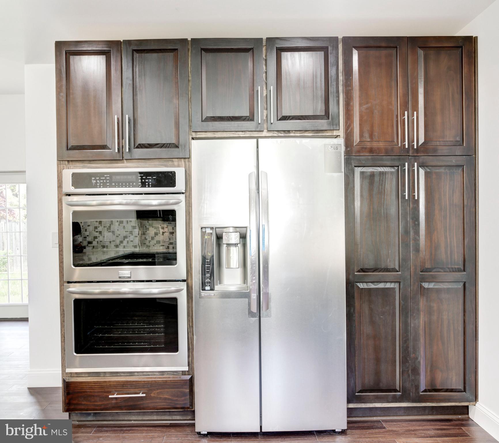 7505 June Street Springfield, VA 22150 - Photo 17 of 29 a kitchen with granite countertop cabinets and steel stainless steel appliances