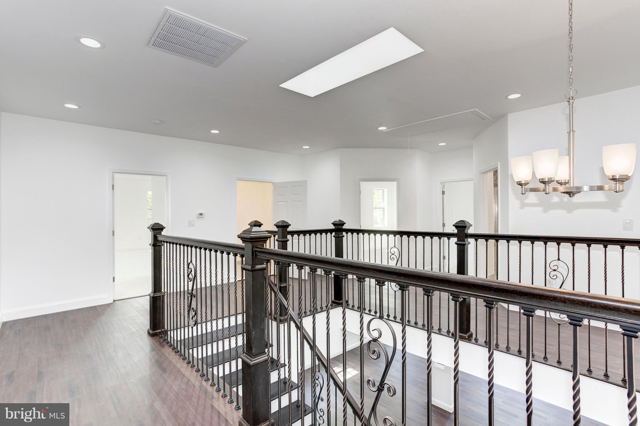 7505 June Street Springfield, VA 22150 - Photo 24 of 29 a view of a hallway with a livingroom