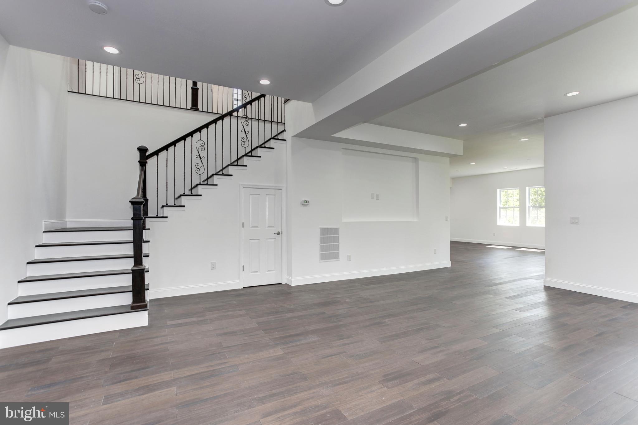 7505 June Street Springfield, VA 22150 - Photo 7 of 29 a view of entryway and hall with wooden floor