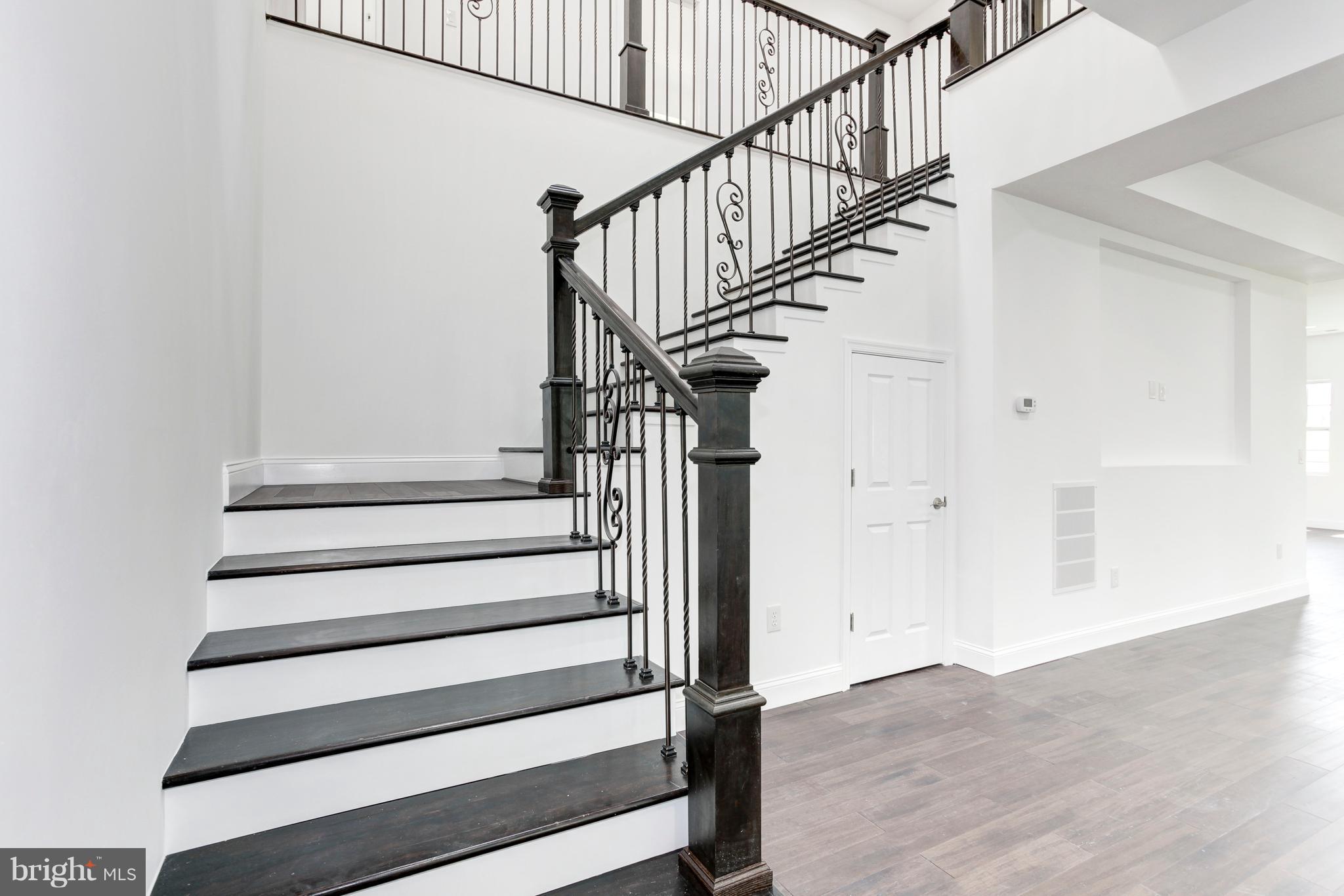 7505 June Street Springfield, VA 22150 - Photo 8 of 29 a view of entryway and hall with wooden floor