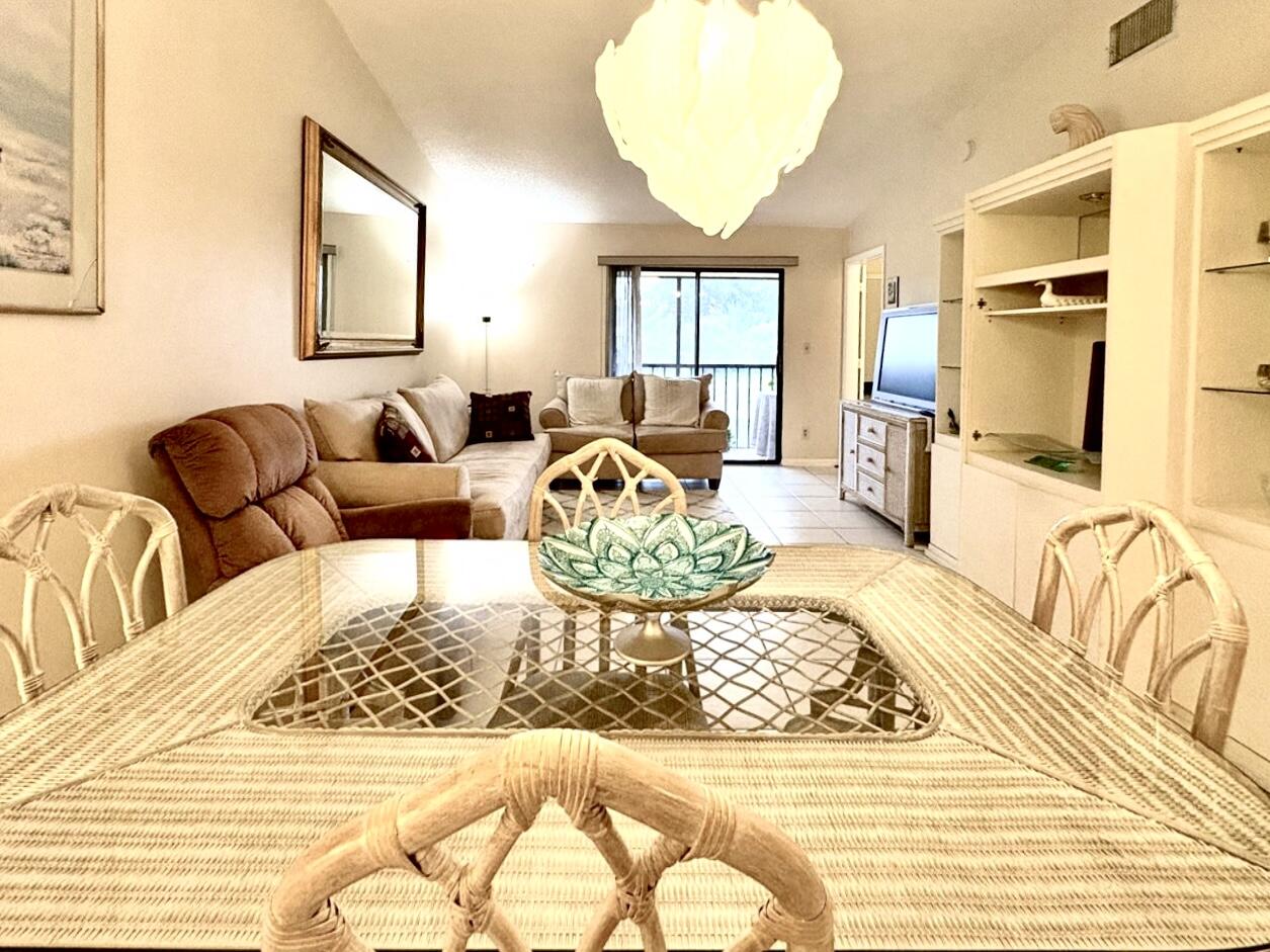 9485 Boca Cove Circle, Unit 709 Boca Raton, FL 33428 - Photo 1 of 42 a living room with furniture