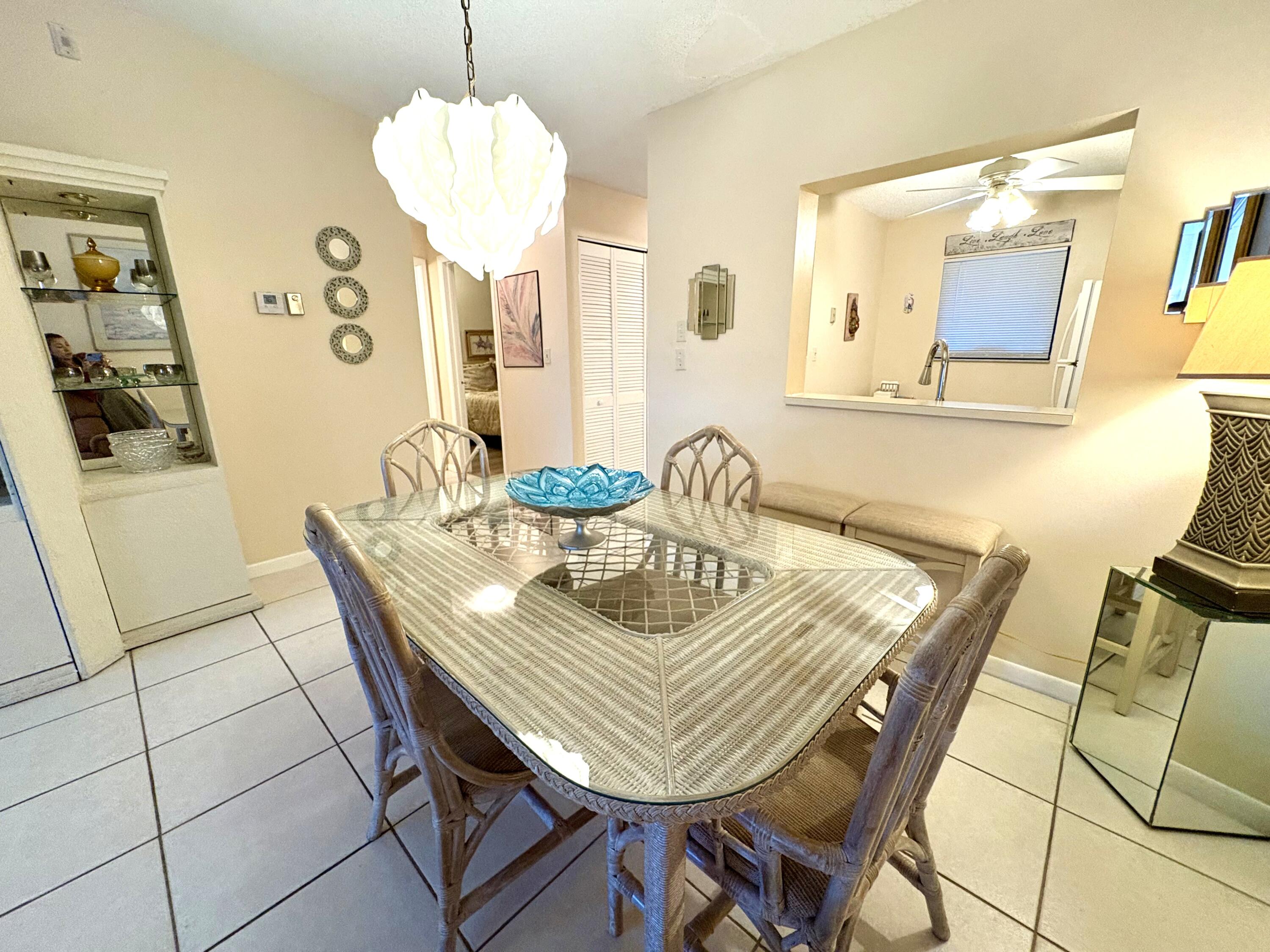 9485 Boca Cove Circle, Unit 709 Boca Raton, FL 33428 - Photo 20 of 42 a view of a dining room with furniture