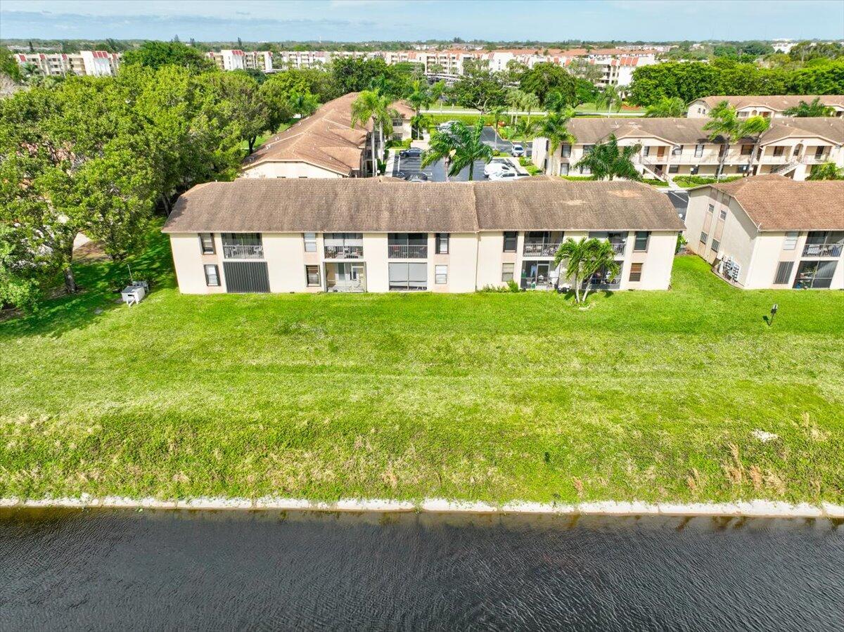 9485 Boca Cove Circle, Unit 709 Boca Raton, FL 33428 - Photo 36 of 42 a aerial view of a house next to a yard