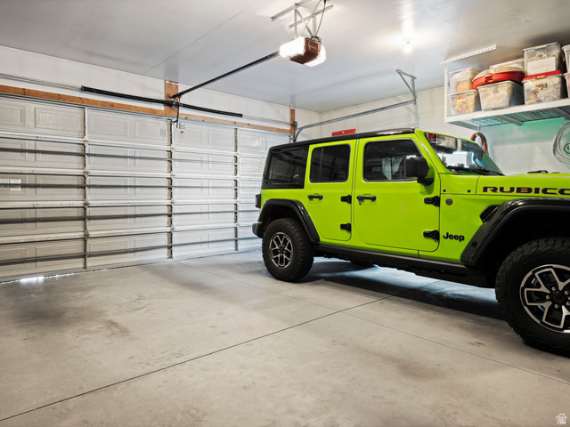 955 West 2390th South Perry, UT 84302 - Photo 40 of 51 Large 2 car garage properly fits 2 vehicles including a full shize truck.