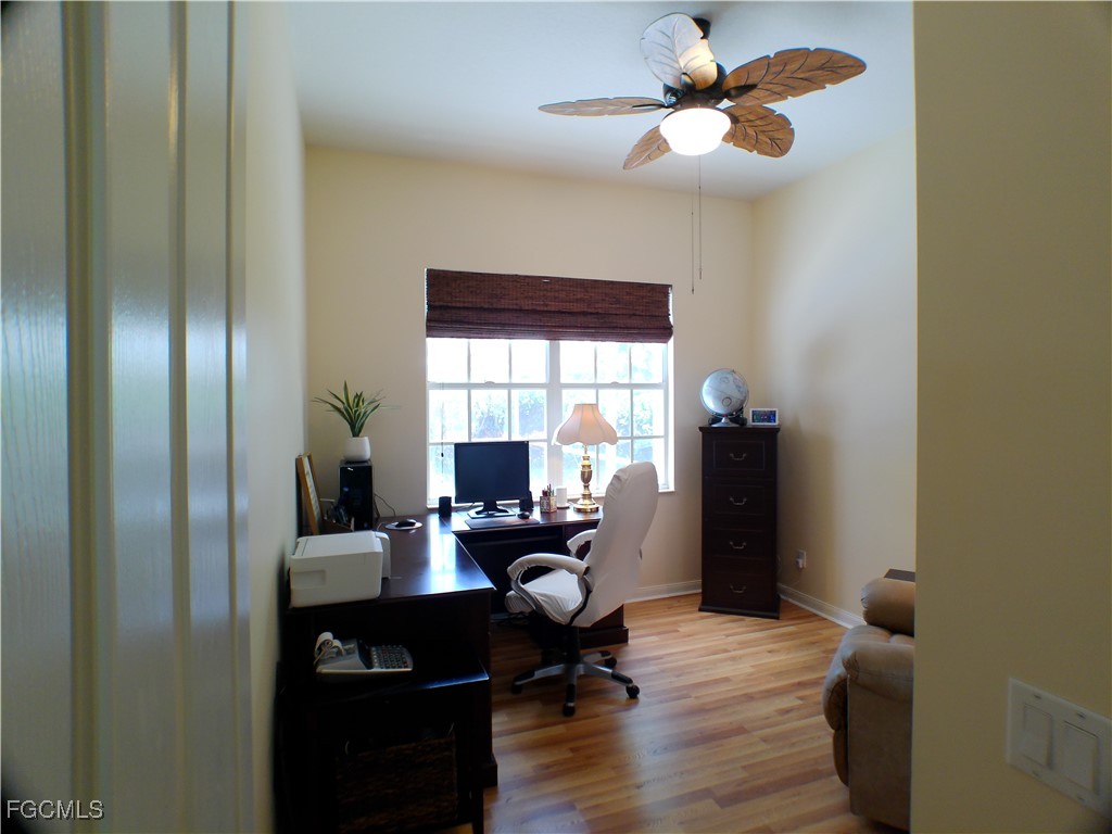 4780 Martinique Way Naples, FL 34119 - Photo 17 of 49 a view of a workspace with furniture and a window