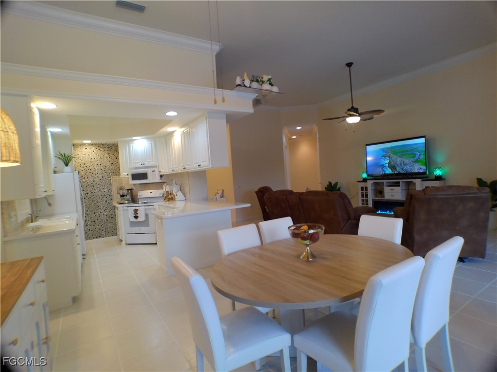 4780 Martinique Way Naples, FL 34119 - Photo 20 of 49 a view of a dining room with furniture