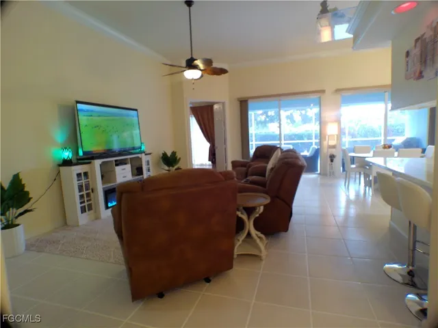 a dining room with furniture and a chandelier