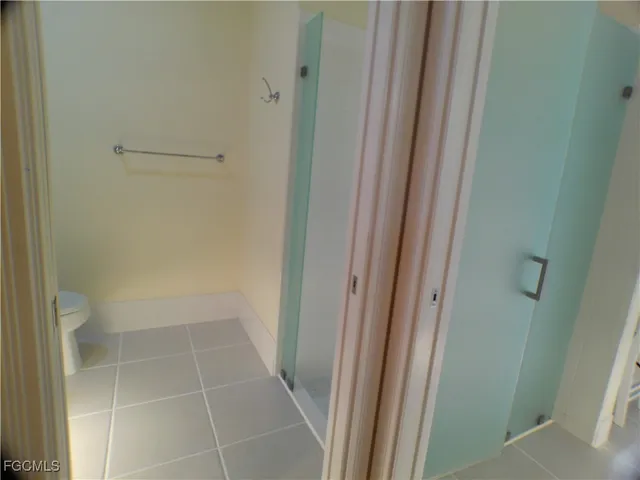 a utility room with cabinets washer and dryer