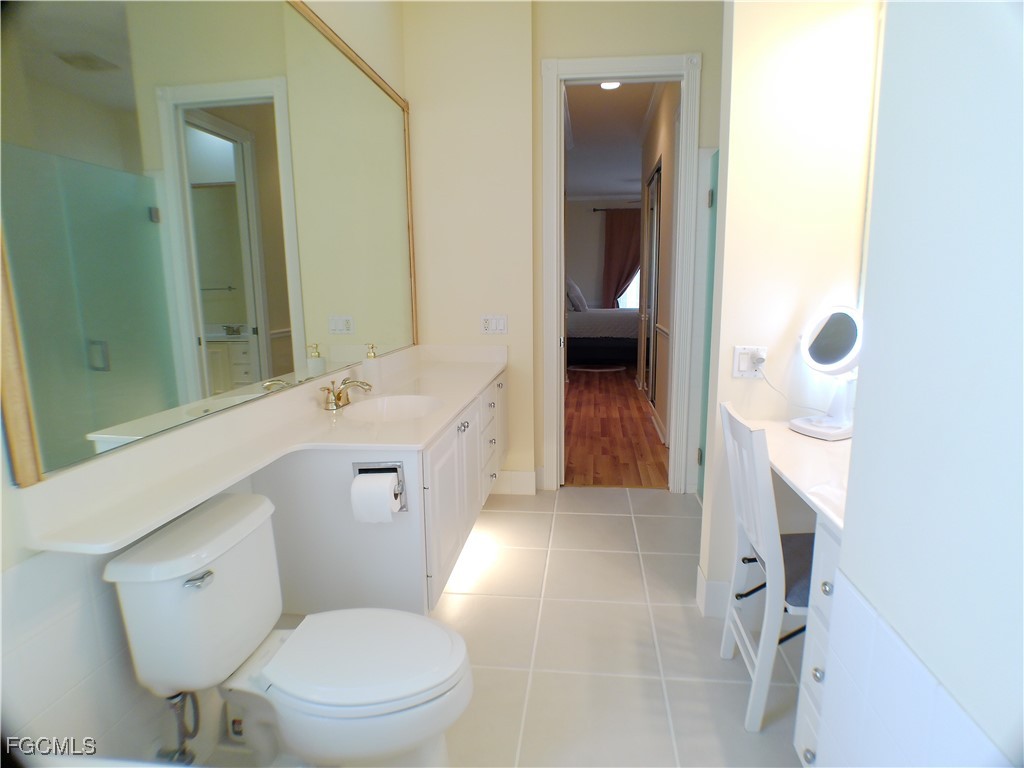 4780 Martinique Way Naples, FL 34119 - Photo 30 of 49 a bathroom with a sink a toilet and shower