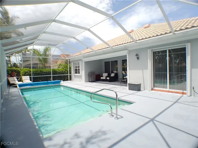 a front view of a house with outdoor seating