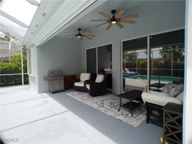 a view of backyard with patio and outdoor seating