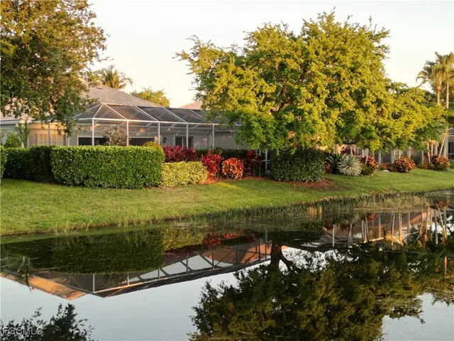 a living room with furniture potted plant and a chandelier