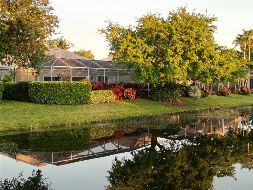 4780 Martinique Way Naples, FL 34119 - Photo 10 of 49 a view of a garden with an outdoor space