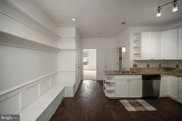 a kitchen with a refrigerator stove and microwave