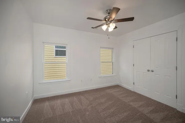 a view of a balcony with two chairs