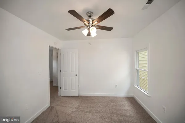 a view of a balcony with wooden floor