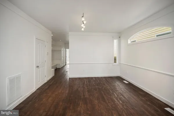 a view of a livingroom with wooden floor