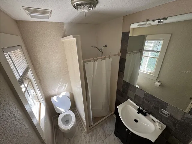 a bathroom with a sink and mirror
