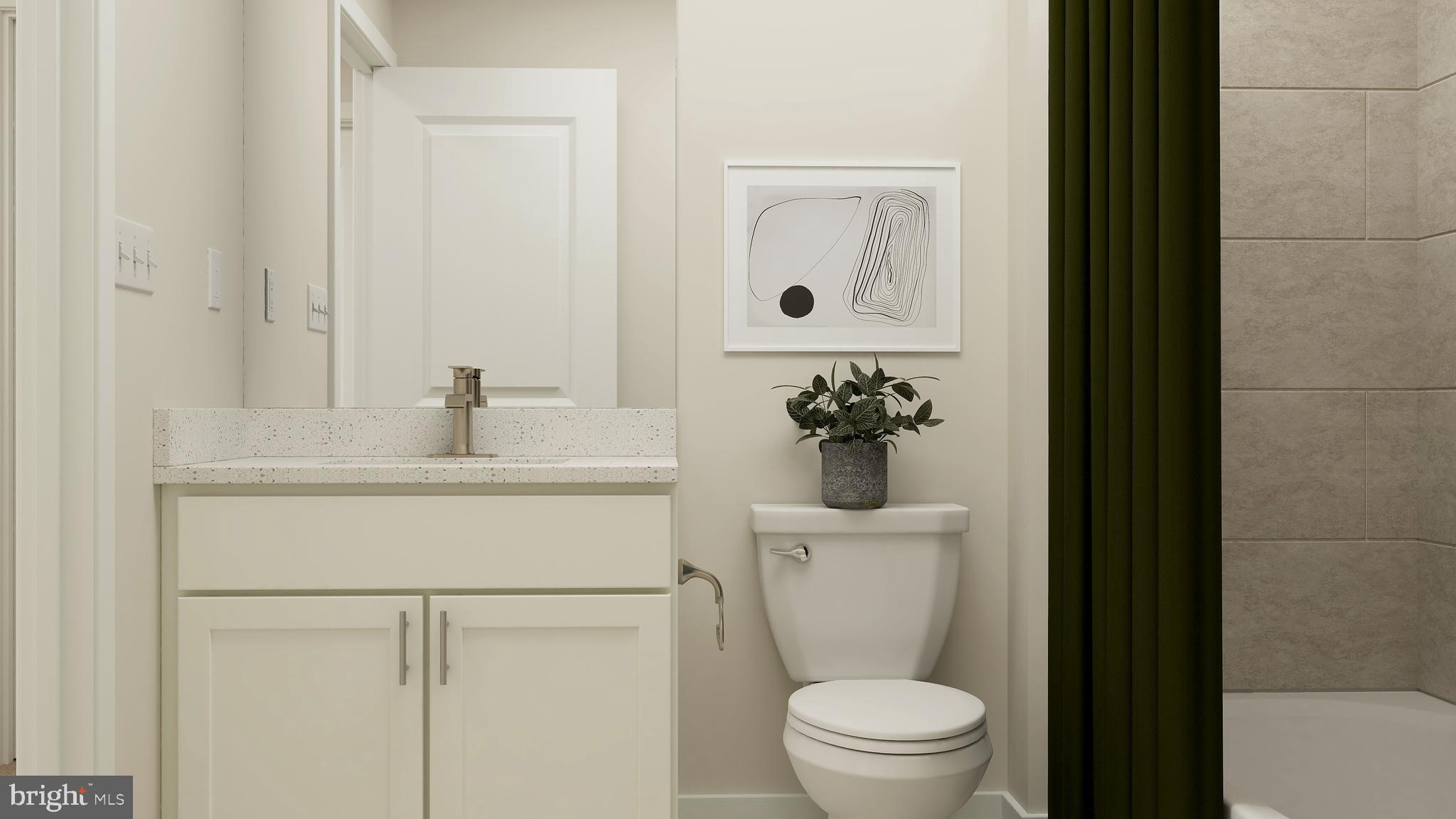 6611 Greenleigh Avenue Middle River, MD 21220 - Photo 14 of 39 a bathroom with a sink toilet and a mirror