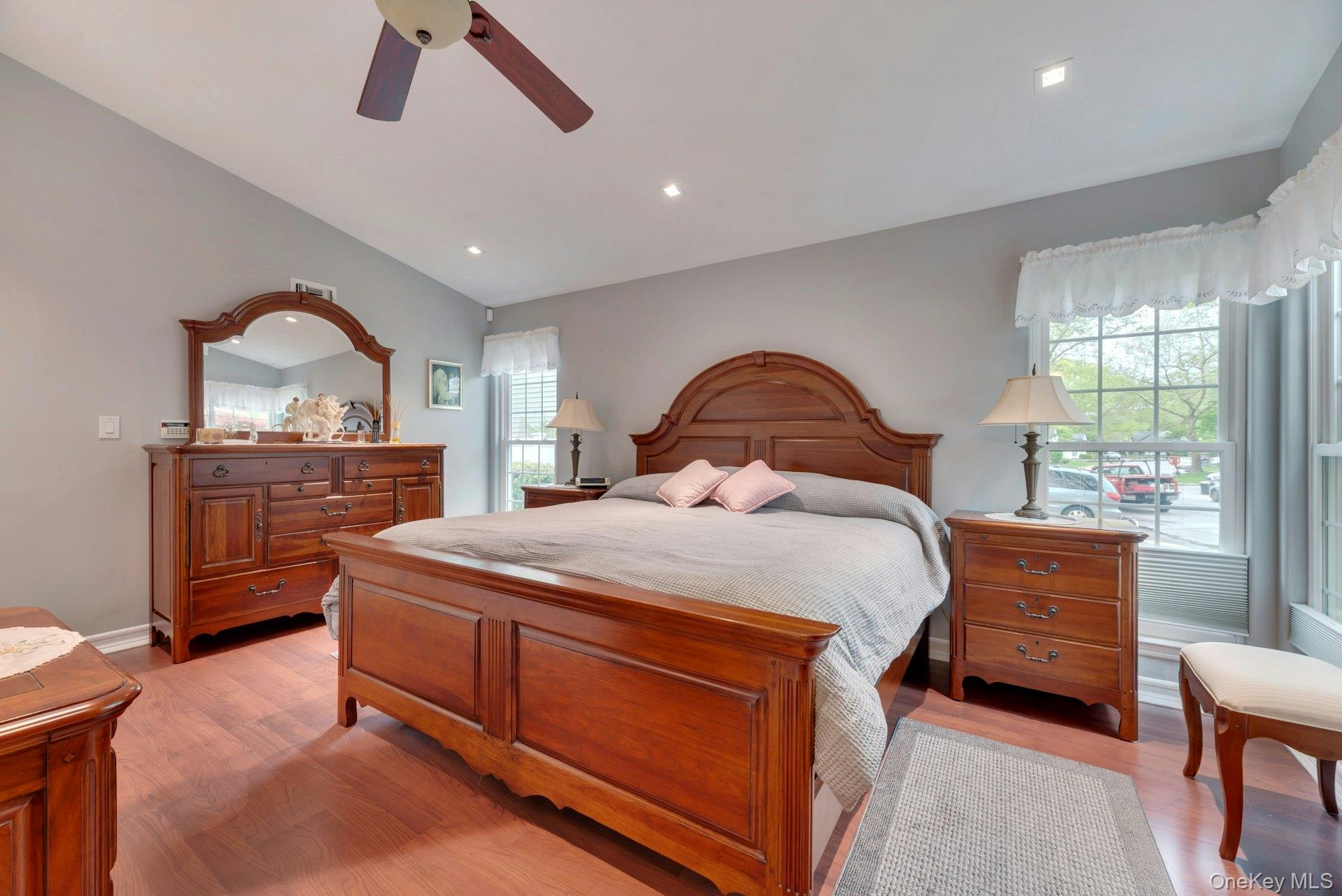 104 Glen Drive Ridge, NY 11961 - Photo 20 of 25 a bedroom with a bed and a dresser next to a window