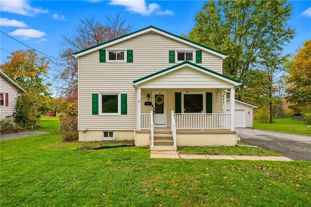 a front view of a house with a yard