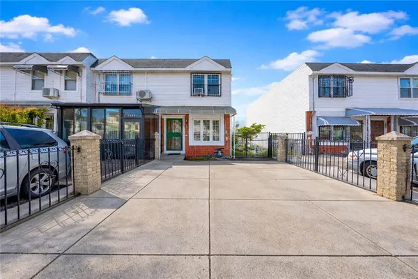 a view of a brick building with many windows