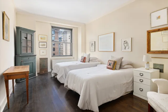 a living room with furniture and a book shelf