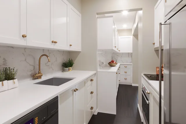 a bathroom with a tub sink and mirror