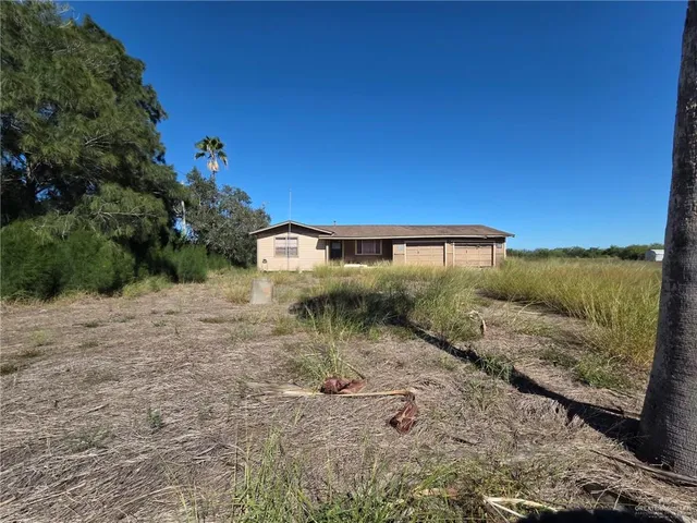 a view of a back yard of the house