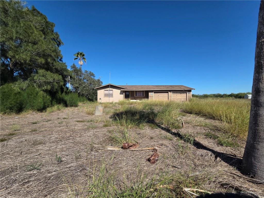 a view of a back yard of the house