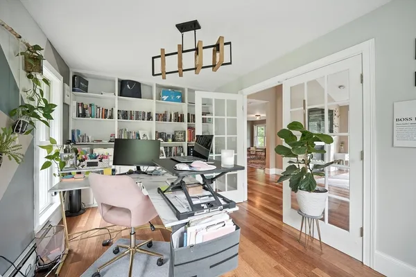 a work room with furniture and wooden floor